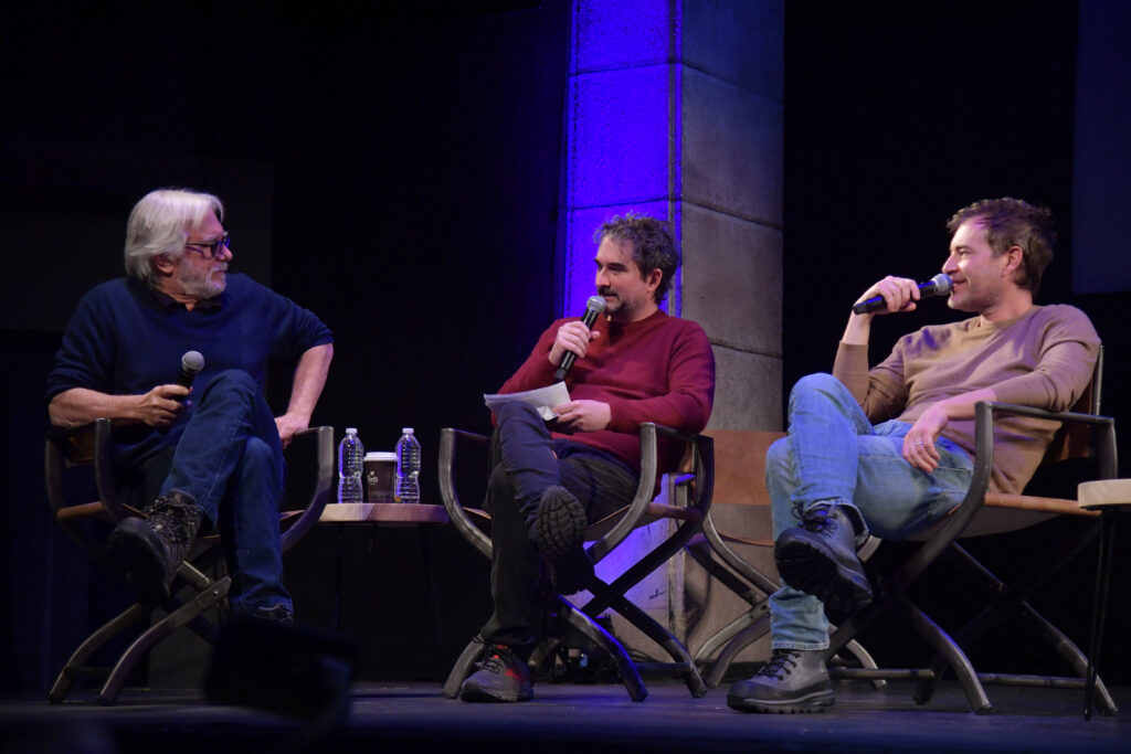 Dean Parisot, Jay Duplass, and Mark Duplass sit on stage at the Egyptian Theatre.